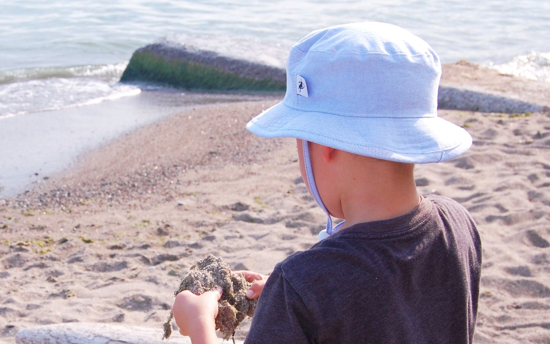 Child and Toddler Sun Protection Hat with Chin Tie, Cord Lock and Safety Break Away Clip-Rated UPF50+ Sun Protection, a must for Outdoor Play. Classic oxford cotton for easy co-ordination. Made in Canada by Puffin Gear