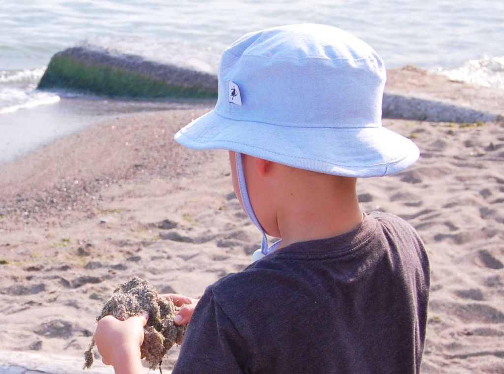 Child and Toddler Sun Protection Hat with Chin Tie, Cord Lock and Safety Break Away Clip-Rated UPF50+ Sun Protection, a must for Outdoor Play. Classic oxford cotton for easy co-ordination. Made in Canada by Puffin Gear