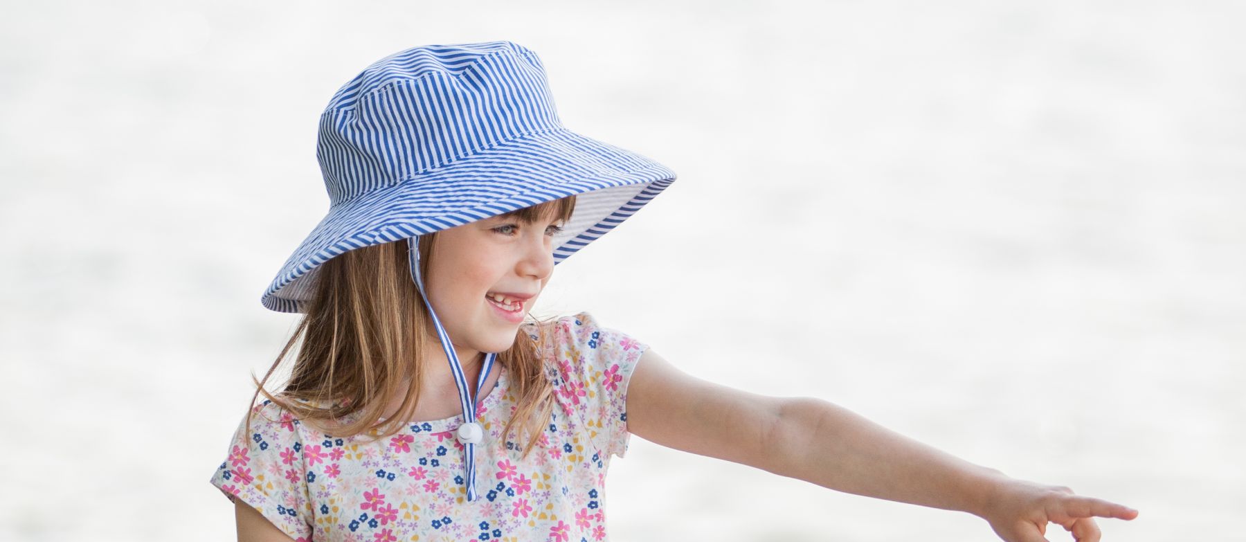 Wide brim kids sun protection hat with chin tie, cordlock, safety breakaway clip-rated UPF50 Excellent sun protection-made in canada by puffin gear-machine washable-cotton prints from classic stripes to liberty of london florals