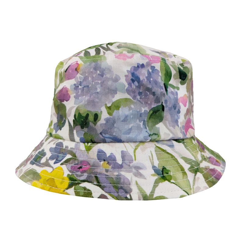 Floral linen bucket hat in pastels shades of daffodil, lilac and cherry blossoms.  UPF 50+ rated stun protection. Made in Canada by Puffin Gear