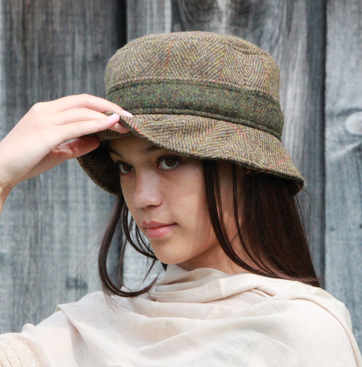 Harris Tweed Wool Bucket Hat in Barley Herringbone with Moss Heather contrast. Harris tweed hand woven in Scotland. Bucket hat carefully made in the Puffin Gear Studio, Toronto, Canada