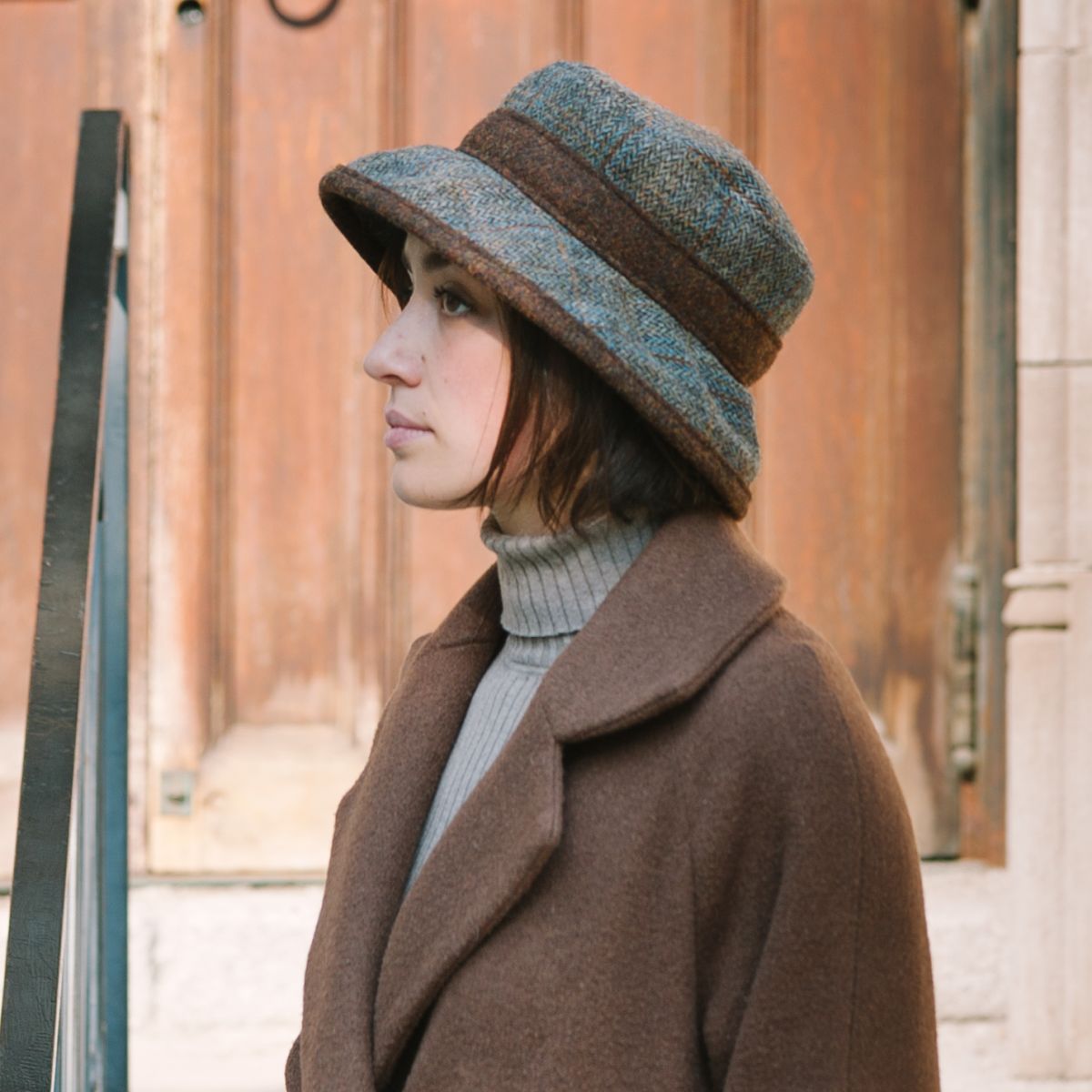 Harris tweed hand woven wool plaid brimmed hat. provides sun protection for face and eyes from winter sun. made in canada by puffin gear