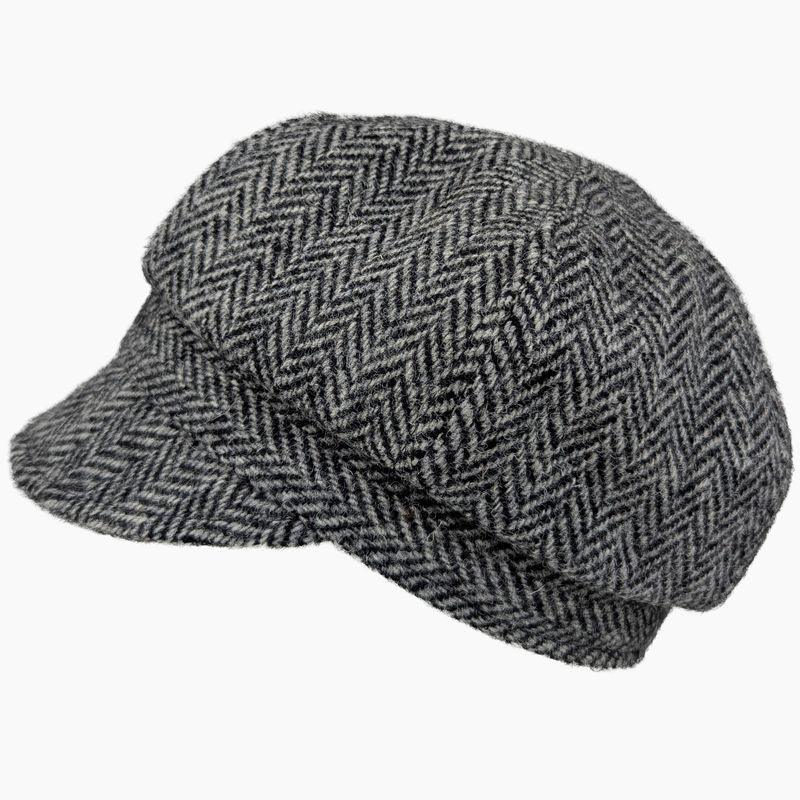 A gray and black herringbone pattern newsboy cap shown from a three-quarters angle on a plain white background.