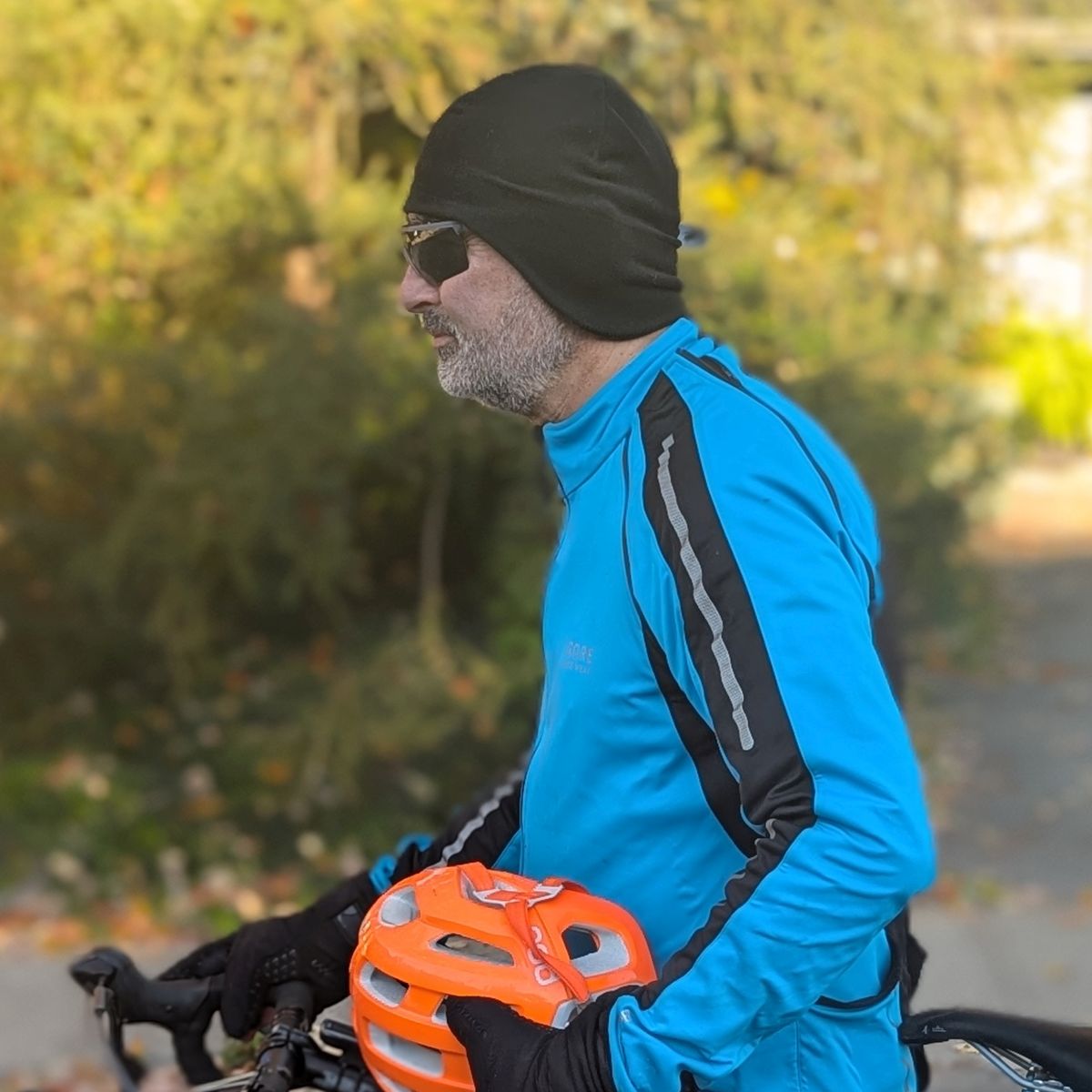 cyclist wearing a black polartec microfleece helmet liner