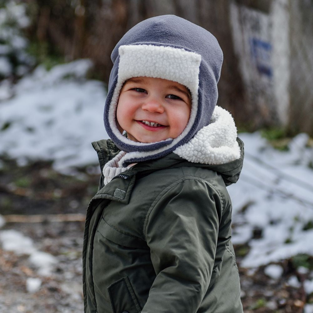 Puffin Gear had made kids hats for over 25 years in Canada. Designed for warmth so kids will love to play outdoors and become life-long outdoor enthusiasts-Polartec Fleece Aviator hat has a sherpa lining and is oh-so cozy. Chinwrap keeps out all the cold