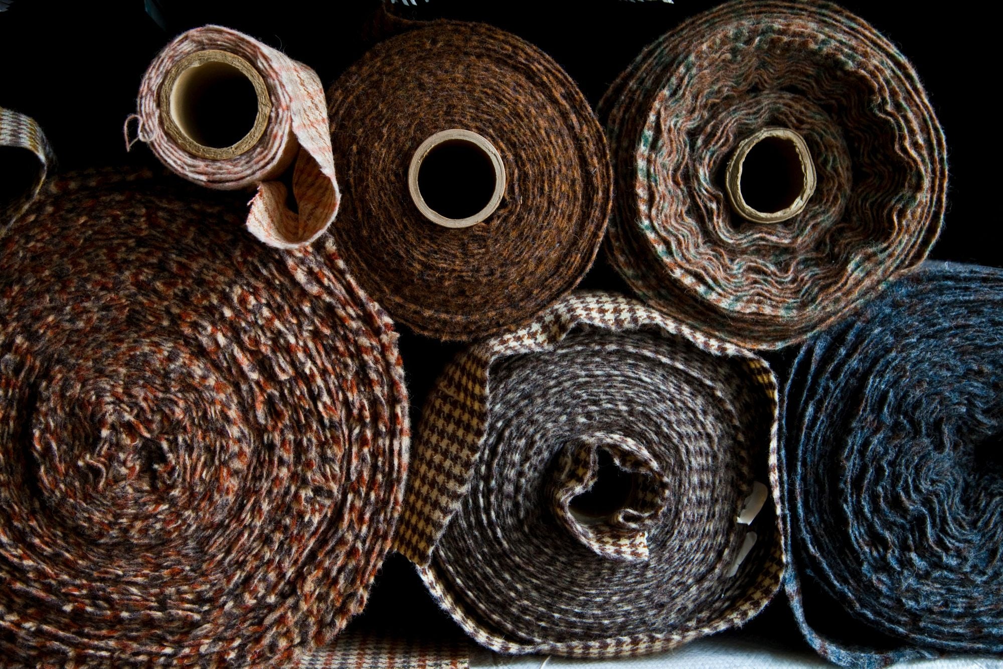 Rolls of Hand Woven Harris Tweed Wool on Shelf at Studio-Hand Woven in Outer Hebrides of Scotland