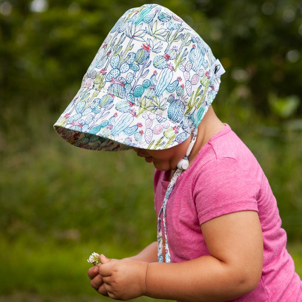Cotton Print Bonnet with Chin Tie and Break away clip to keep bonnet safely in place. UPF50 Sun Protection Rating. made in canada by Puffin Gear.