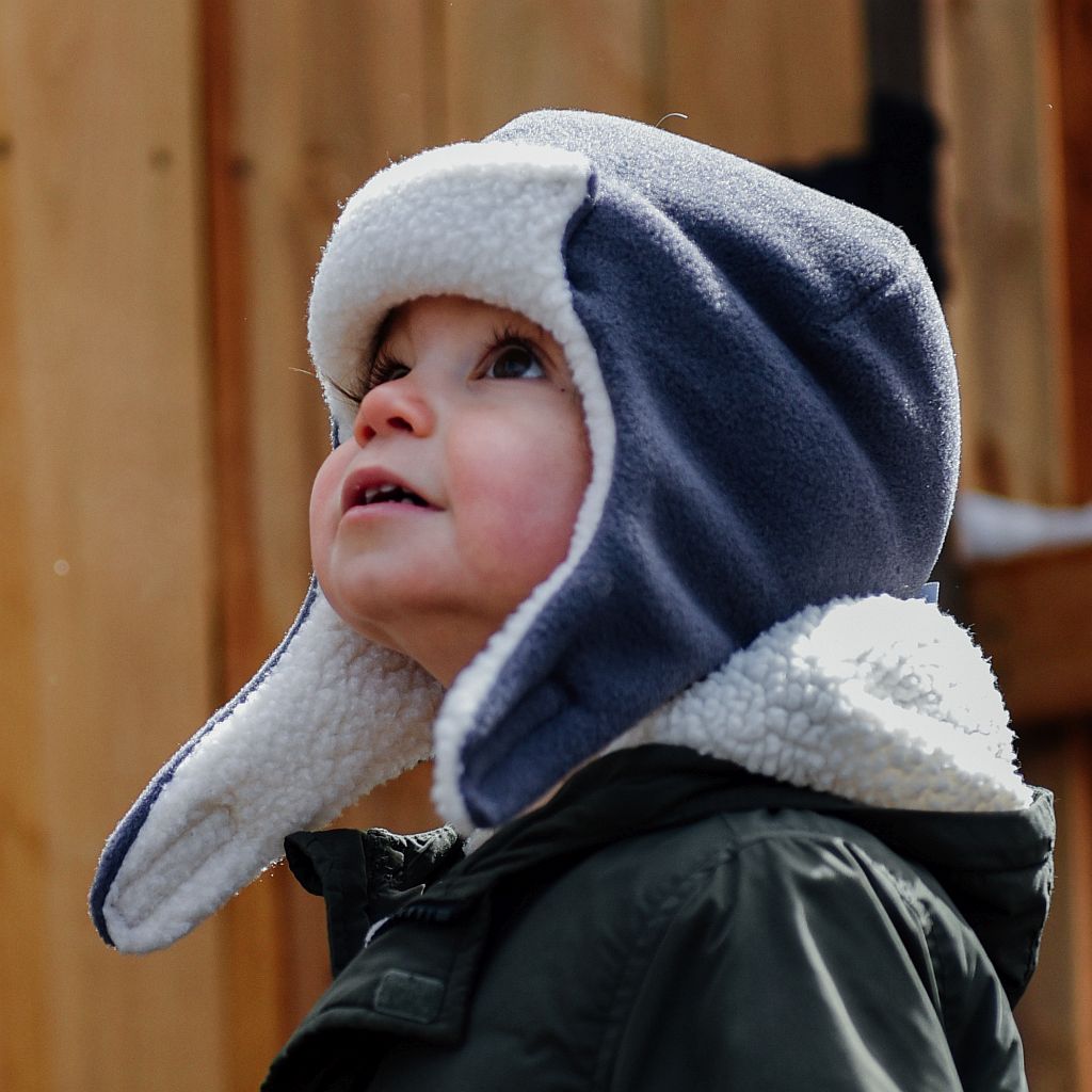 Polartec 200 Fleece Kids Aviator with a 300 series fleece sherpa lining. Incredibly warm for hours of cold weather outdoor play. Made in Canada by Puffin Gear